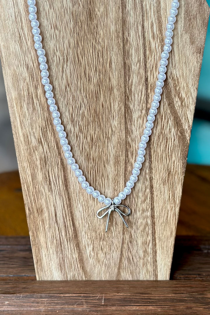 Pearl Bead Necklace Featuring Bow Pendant - Silver