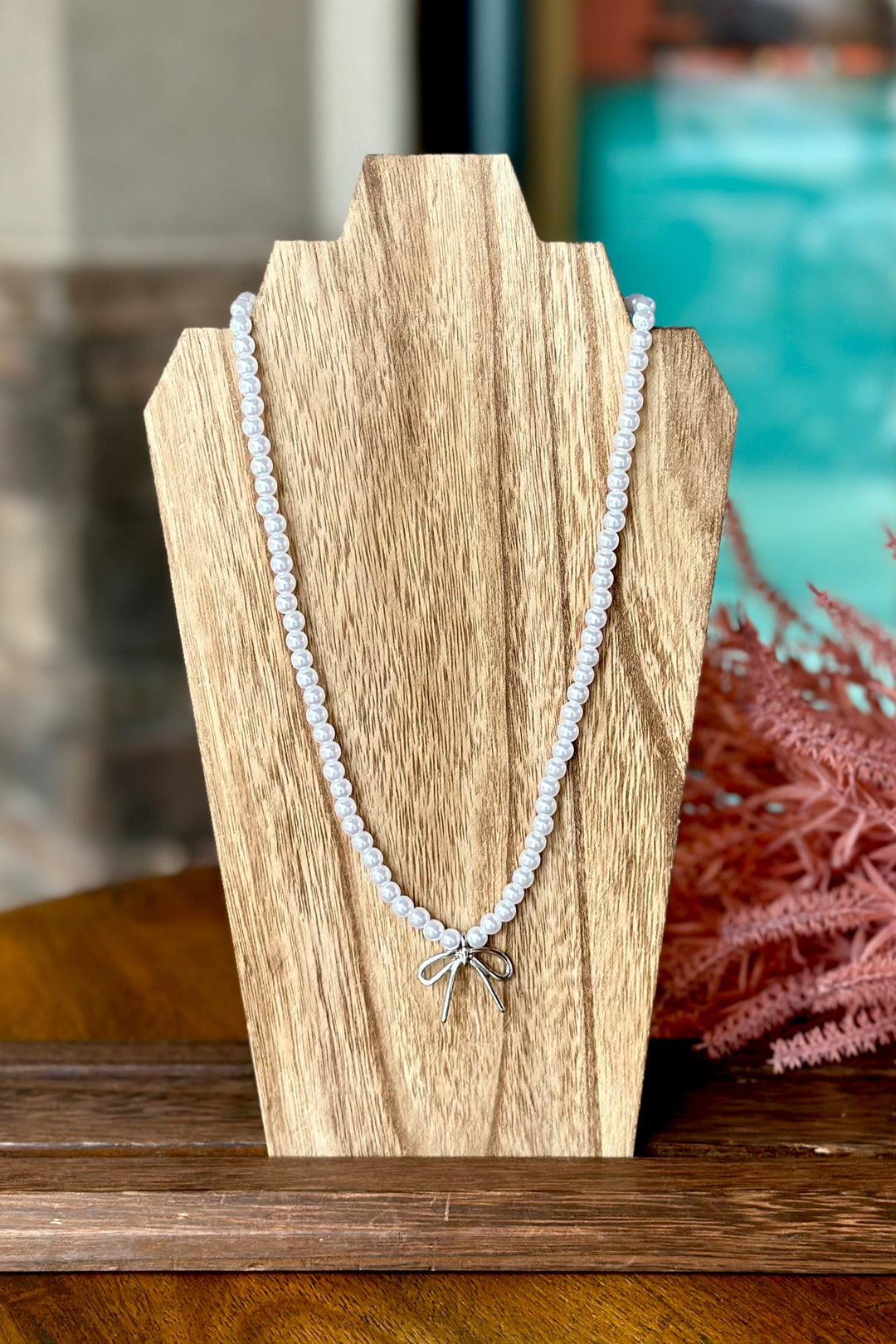 Pearl Bead Necklace Featuring Bow Pendant - Silver